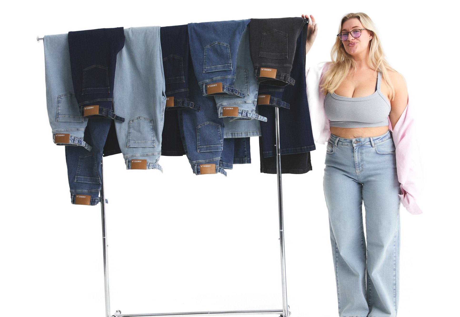Carys Whittaker beside a rail of Ambela jeans
